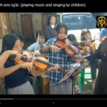 A hmo gui tumkhong neh ami ng’äi. (playing music and singing by children).